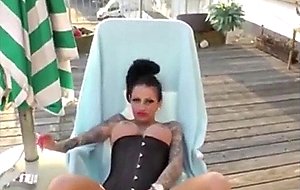 Busty brunette smoking and masturbating 