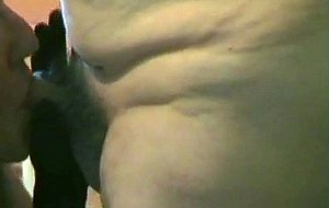 Mature crossdresser sucking a pecker