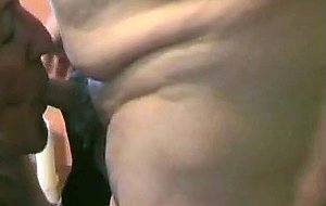 Mature crossdresser sucking a pecker