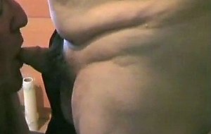Mature crossdresser sucking a pecker