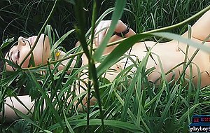 Natural MILF beauty enjoys the nature and flowers outdoor