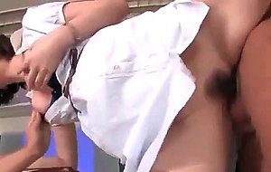 Jap teacher sucks and fucks two big shafts in 3some at school