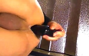 Amateur in mask dildoing ass on the floor