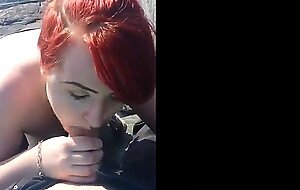 Red hair painted girl sucks dick outdoors and swallows