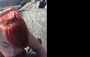 Red hair painted girl sucks dick outdoors and swallows
