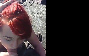 Red hair painted girl sucks dick outdoors and swallows