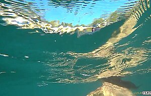 Goldteachers, naked model swims on a public beach in ru