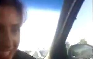 Pierced Brunette Blows in the Car