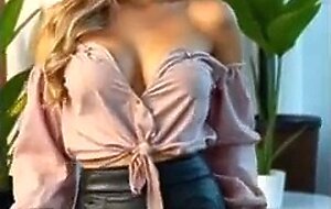 Cute blonde girl looks sexy and desirable by showing her breasts and provocative ass (18