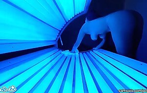 teen latina college student gives lesbian pussy a massage in tanning bed