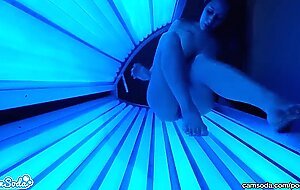 teen latina college student gives lesbian pussy a massage in tanning bed