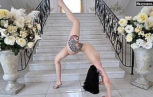 Amazing shape big tits tattooed teen Dasha Gaga doing acrobatics on floor