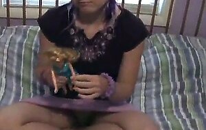 Nubile teen kitty playing with her little dolls