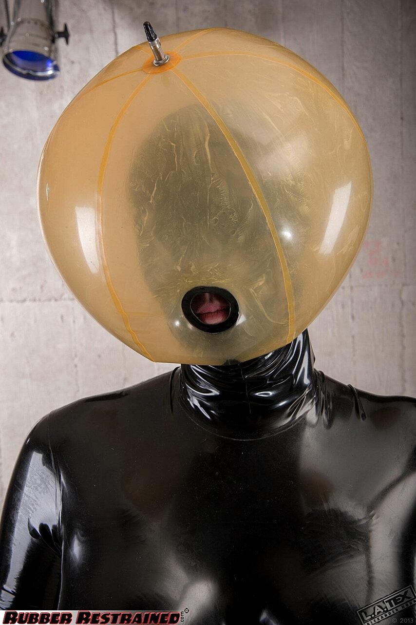 Fetish model Dutch Dame is restrained in kinky latex apparel