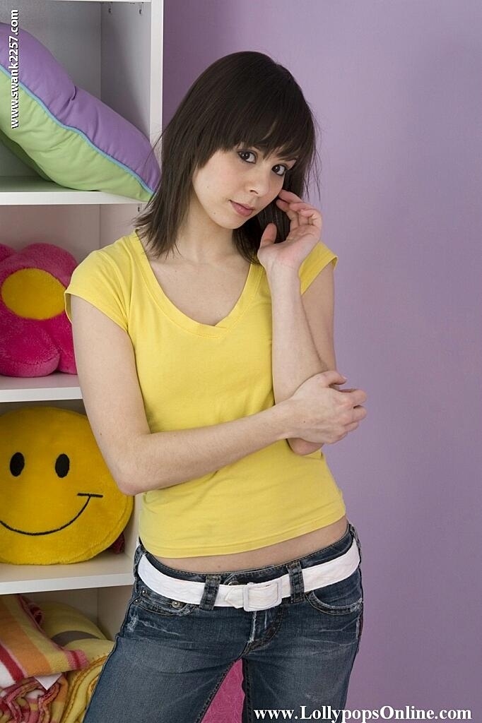 Petite MILF Ariel Rebel posing in her yellow shirt and tight jeans