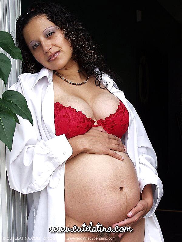 Pregnant Latina female show her milk filled tits and belly bump in the nude