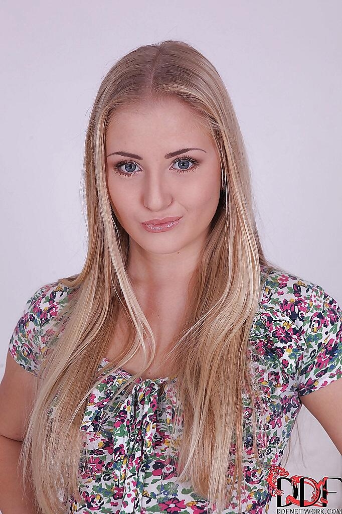 Sweetly-pretty blondie with long legs undressing and spreading her cunt, Cayla Lyons