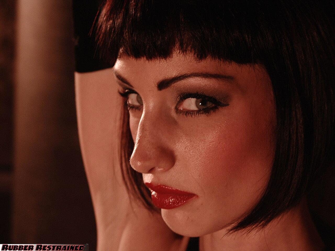 A Femme Fatale Is Restrained With Her Hands Above Her Head In A Dungeon, Sofia Valentine Bdsm, Boots, Latex, Milf, Short-Hair